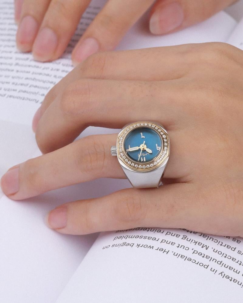 Women's ring watch with an eye-catching design in gold and silver