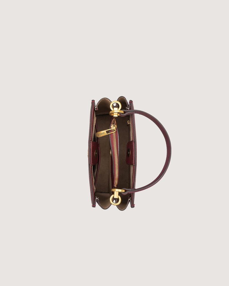 A versatile leather bag in a burgundy color