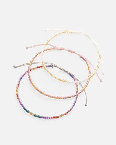 Bracelets made of threads and beads in a harmonious range of colors