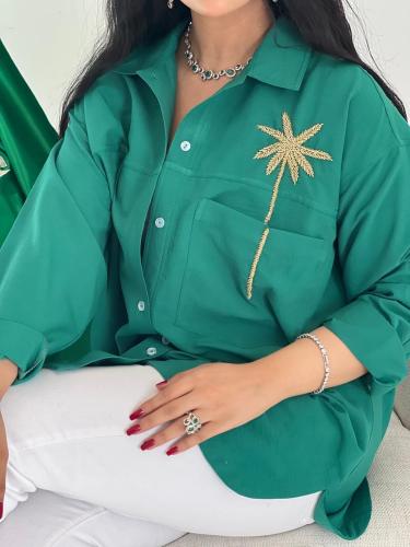 قميص مميز اللون اخضرّ مع شك ذهبي