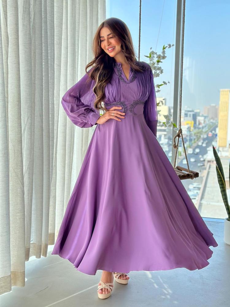 A dress made of two fabrics soft chiffon with a shiny crushed finish decorated with hand embroidered tulle and crepe satin fabric lilac on the bottom