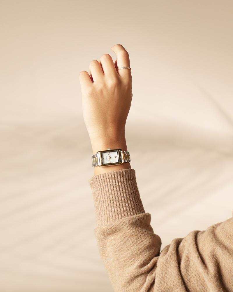 Women's watch with a gold and silver steel strap
