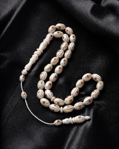 Ivory (elephant tusk) rosary engraved with silver and amber-like