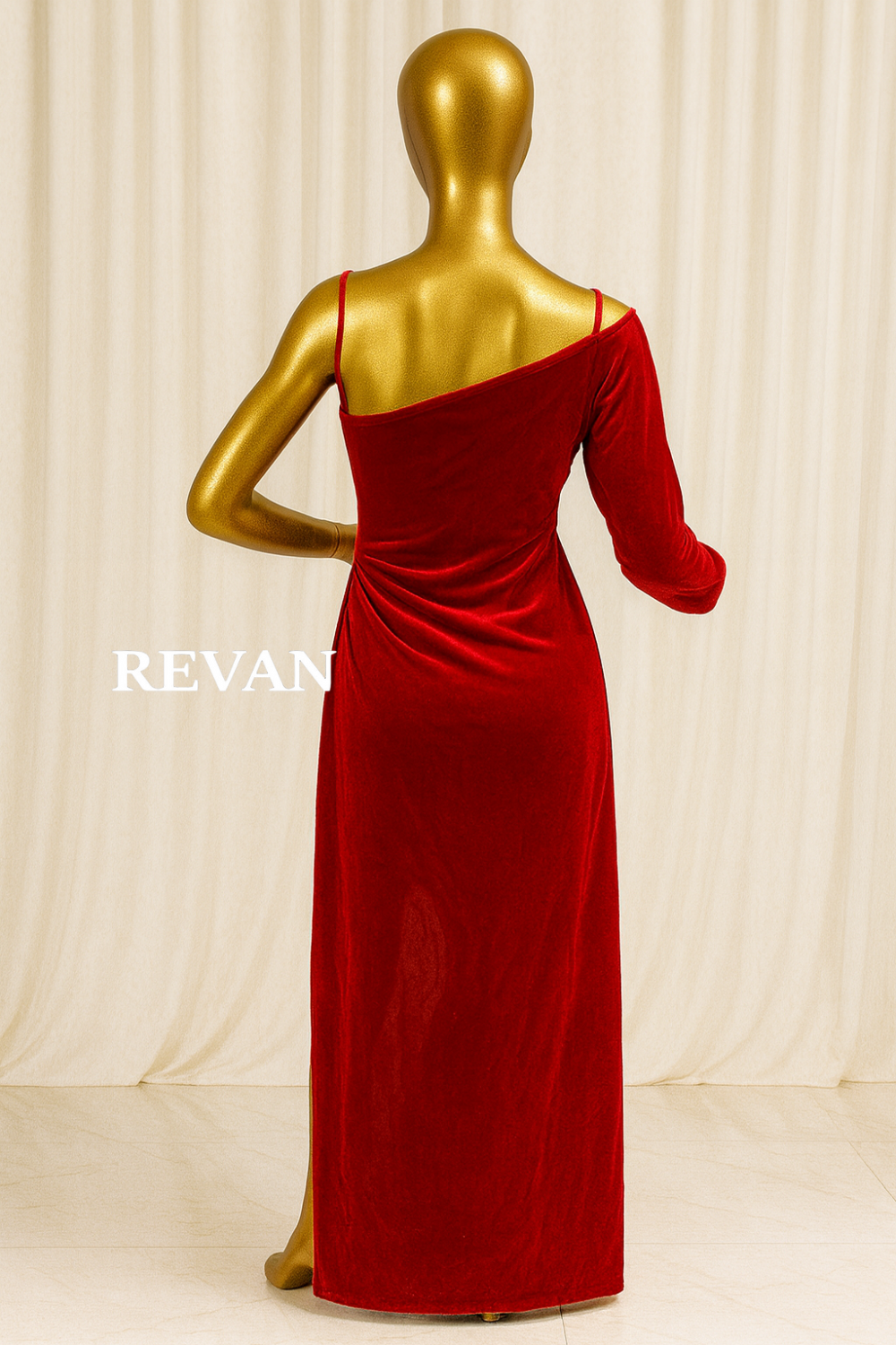 A luxurious one-shoulder red velvet evening gown from Rivan -