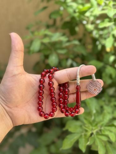 سبحة بكلايت بلون (شفاف احمر) بطربزونة نحاس
