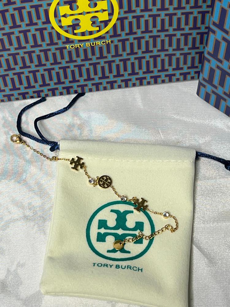 إسوارة TORY BURCH معدن ذهبي بفصوص