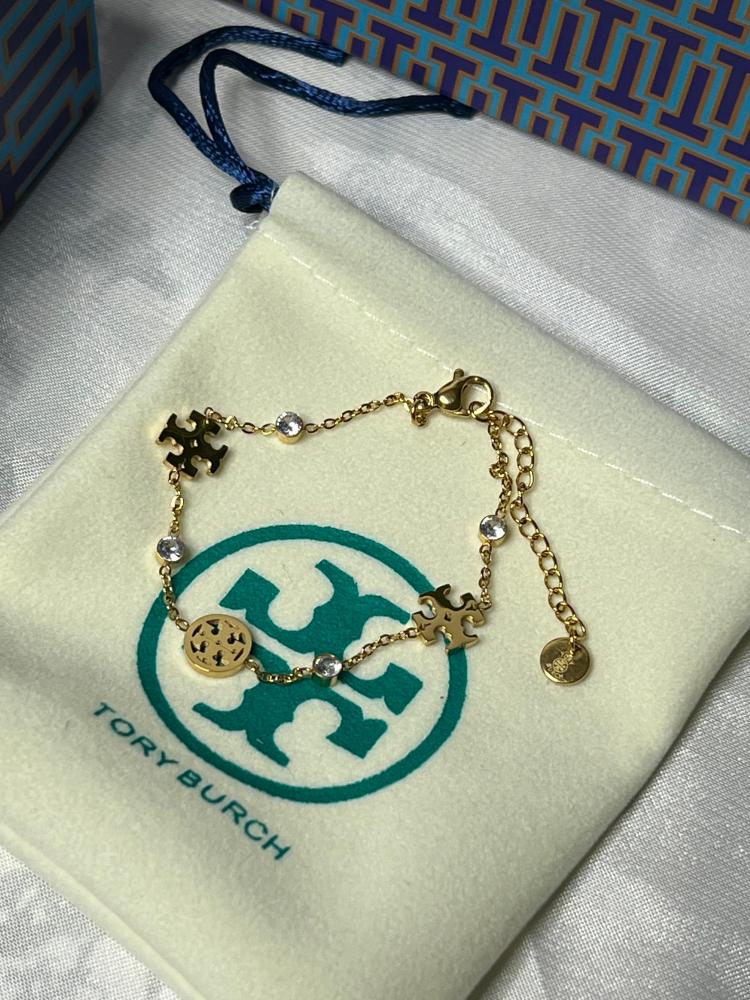 إسوارة TORY BURCH معدن ذهبي بفصوص