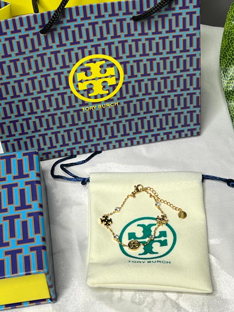 إسوارة TORY BURCH معدن ذهبي بفصوص