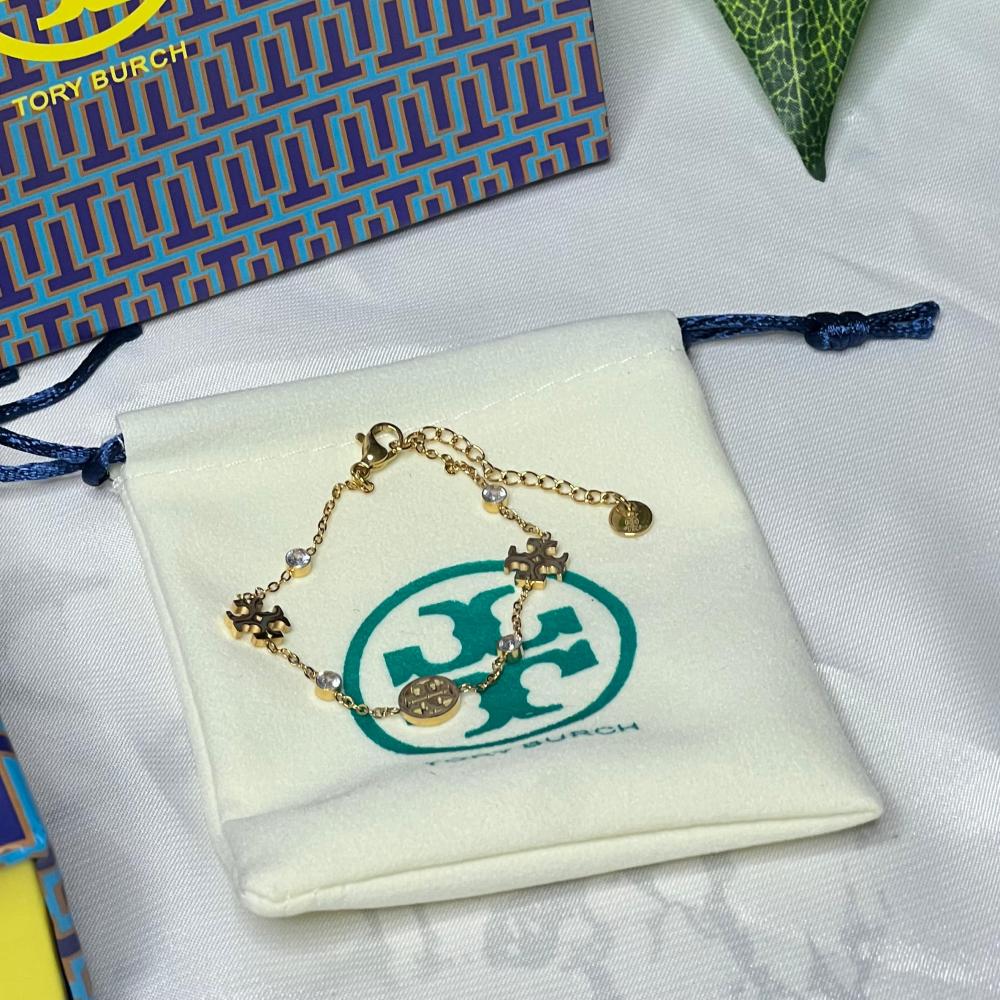 إسوارة TORY BURCH معدن ذهبي بفصوص