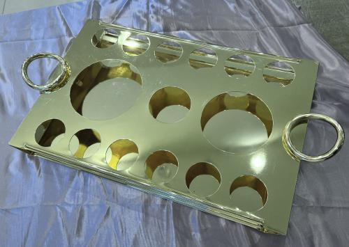 A tray of golden cups