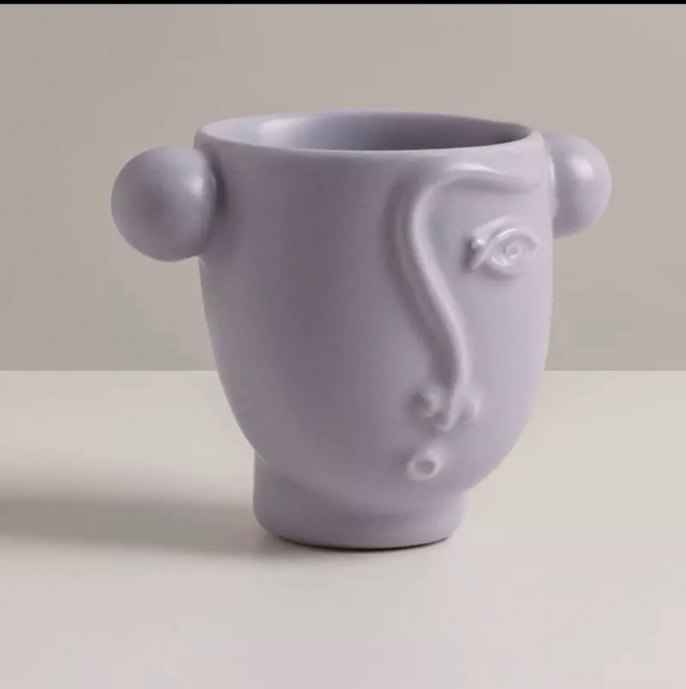 كوب على شكل رسمة وجهه