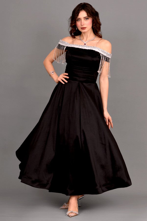 Black off-shoulder evening dress with tassels