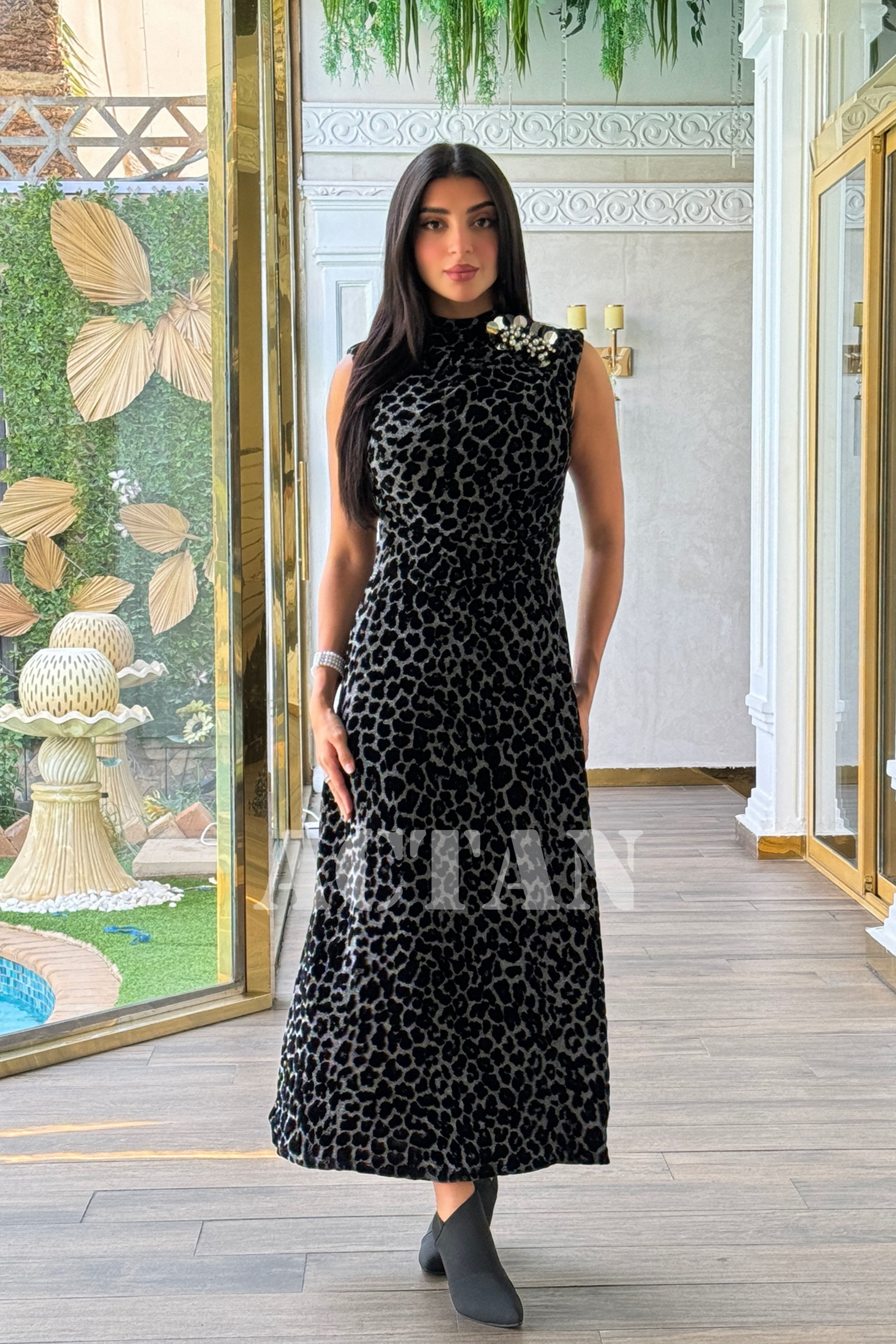 Leopard print velvet dress with brooch