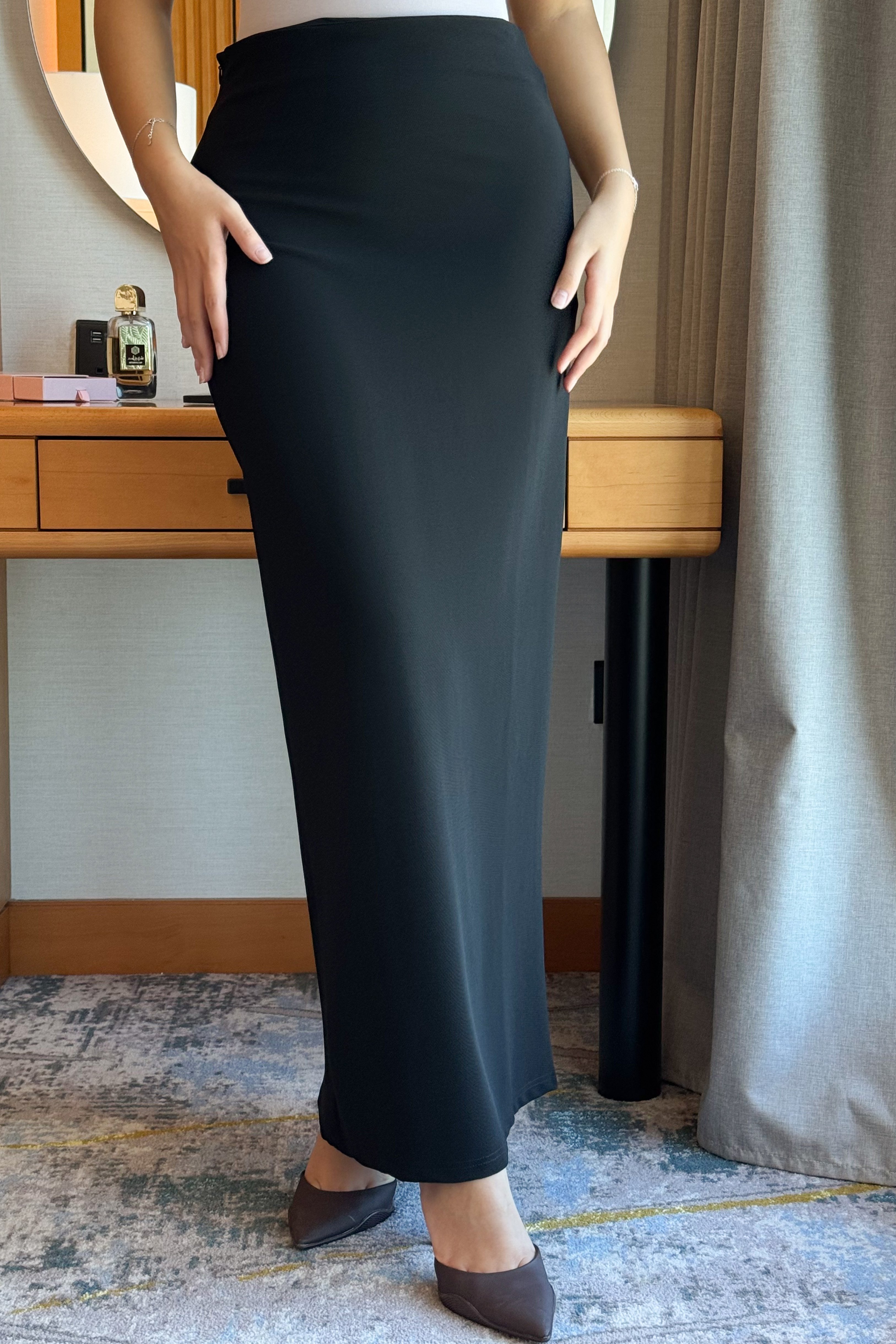 Black long, slim-fit skirt