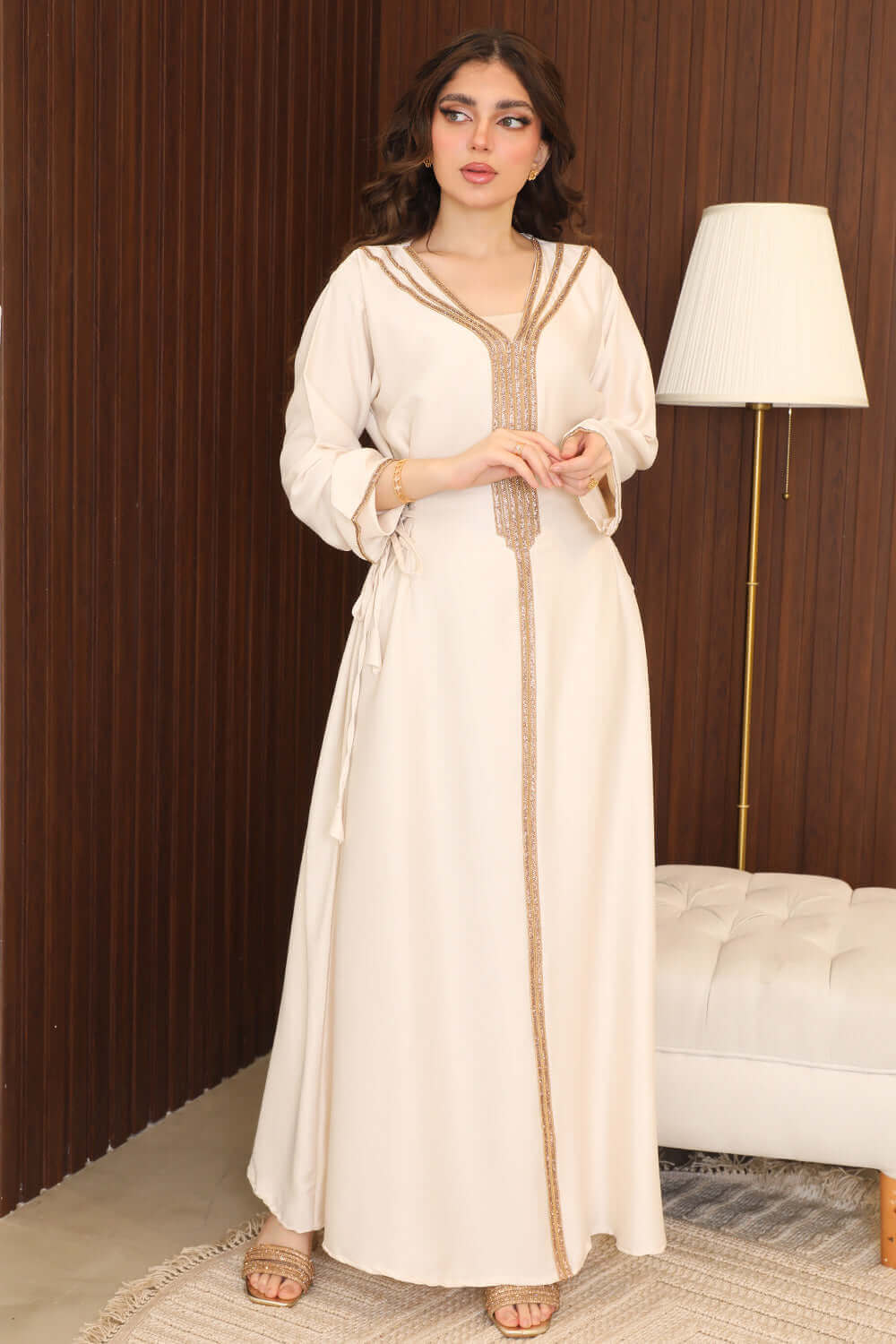 Beige jalabiya with a side tie decorated with golden stones