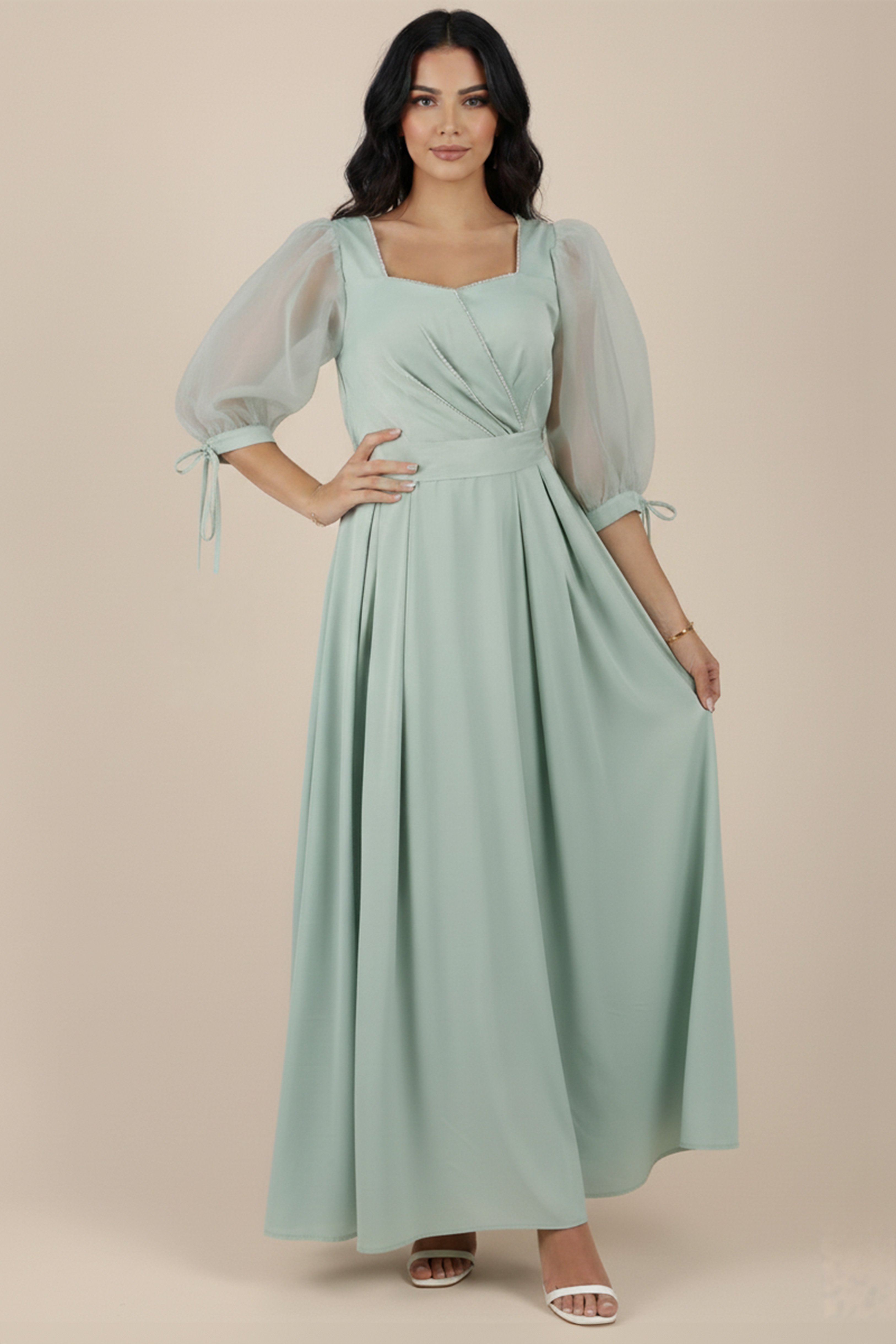 Green satin midi dress with crystal embroidery on the chest