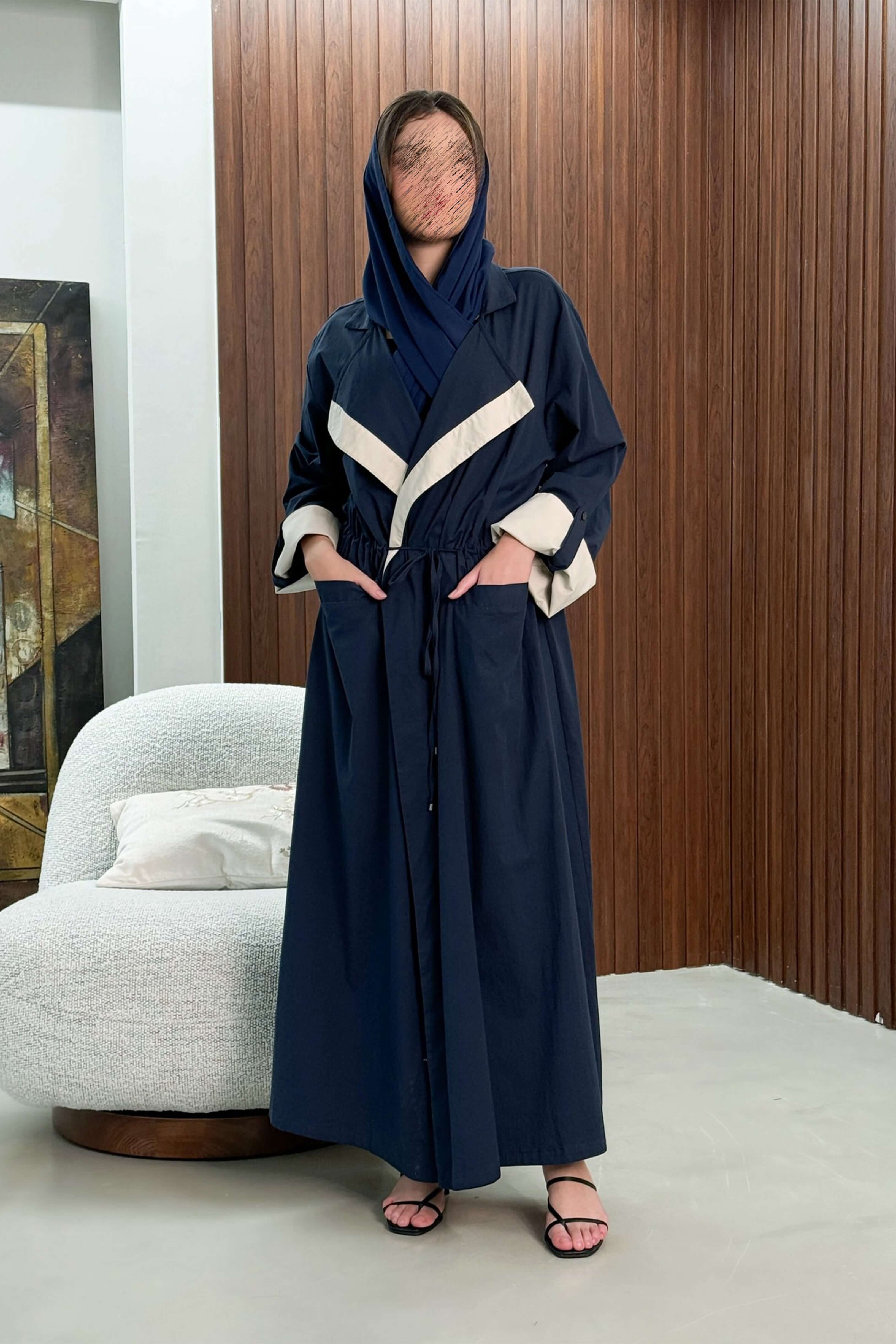 Navy blue folded collar abaya with a tie at the waist