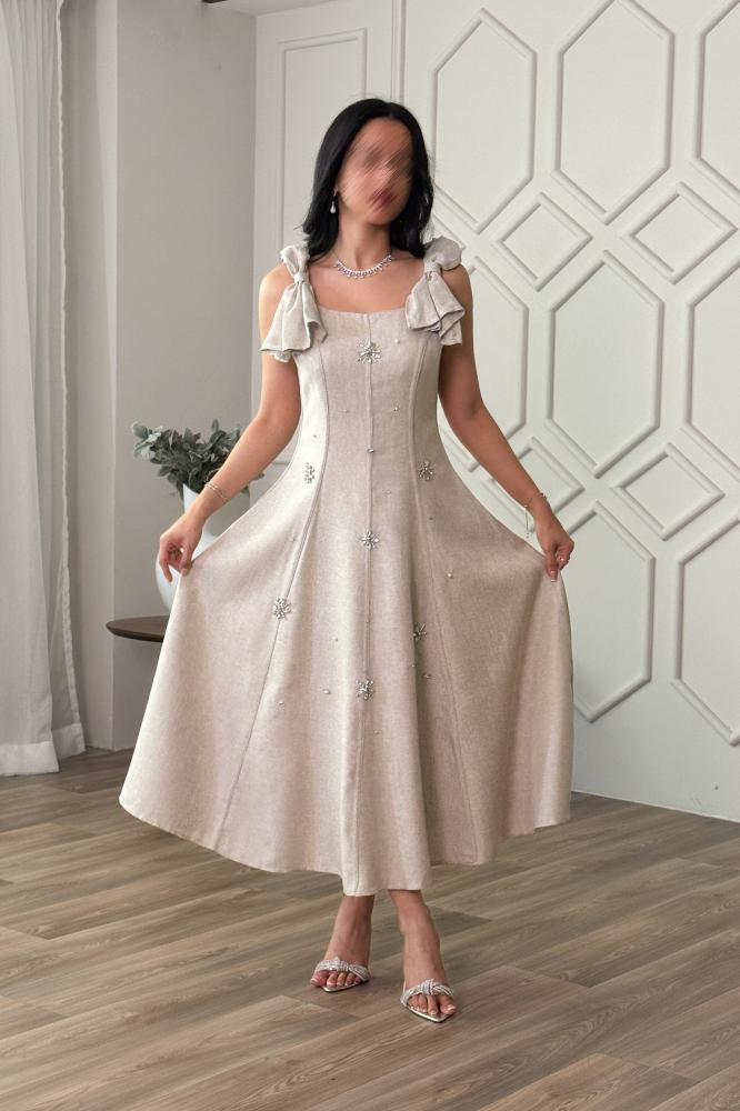 Beige midi dress with dropped shoulders and bow at the back المقاس:(L - 40)