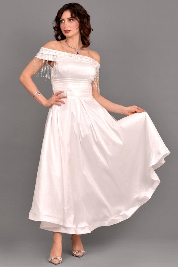 White off-shoulder evening dress with tassels