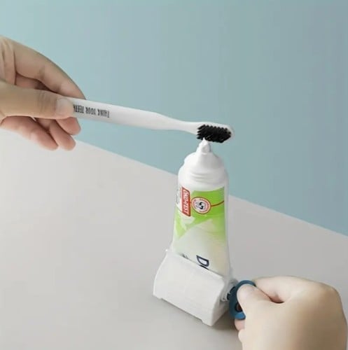 موزع لمعجون الاسنان