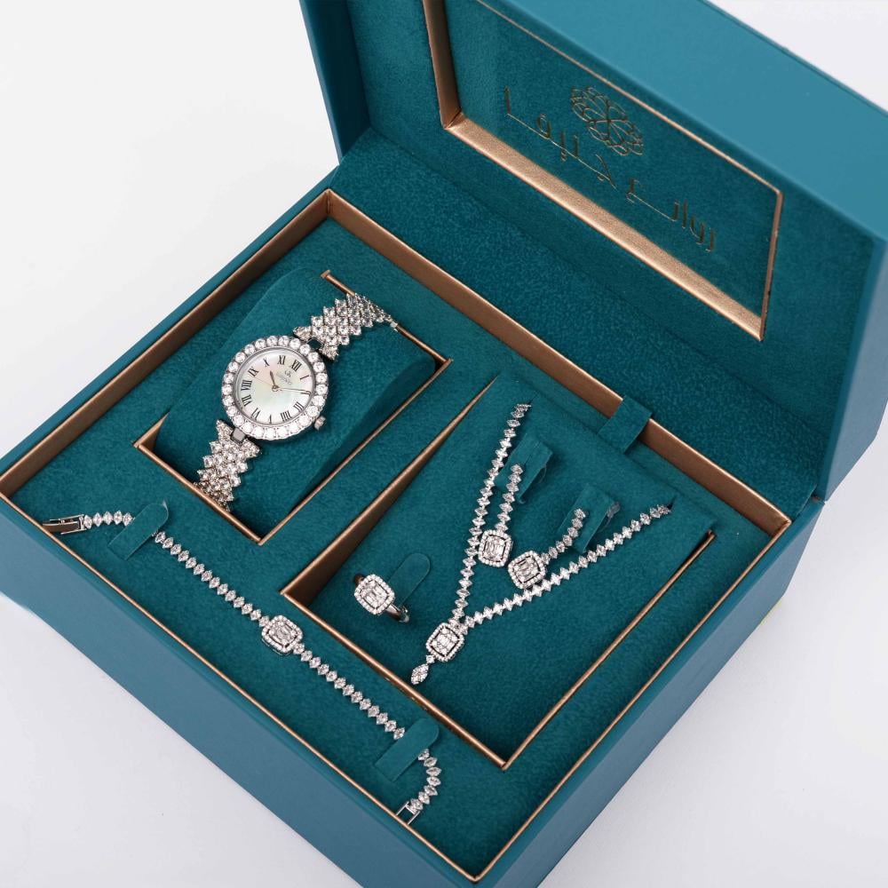 طقم نسائي سهرات  ماركة جورج كلاين GK-51015 (ساعة+سلسال+حلق+خاتم+اسواره ) فضي