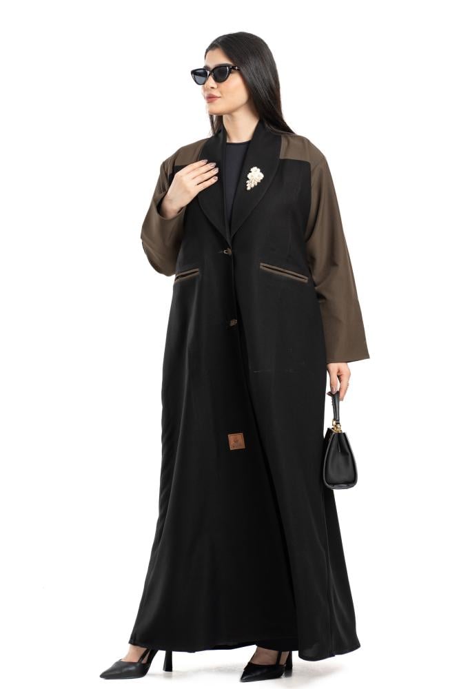 A glamorous abaya with rose embroidery and beaded details.