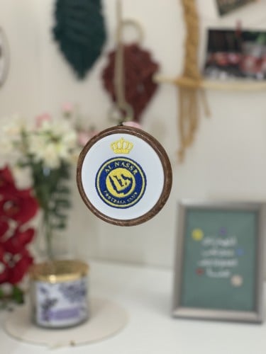 تعليقه سياره بوجهين شعار النصر وقميص الدون