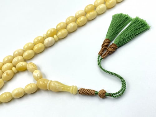 سبحة كهرمان فرز من نقتس كريمي بطقات بياض