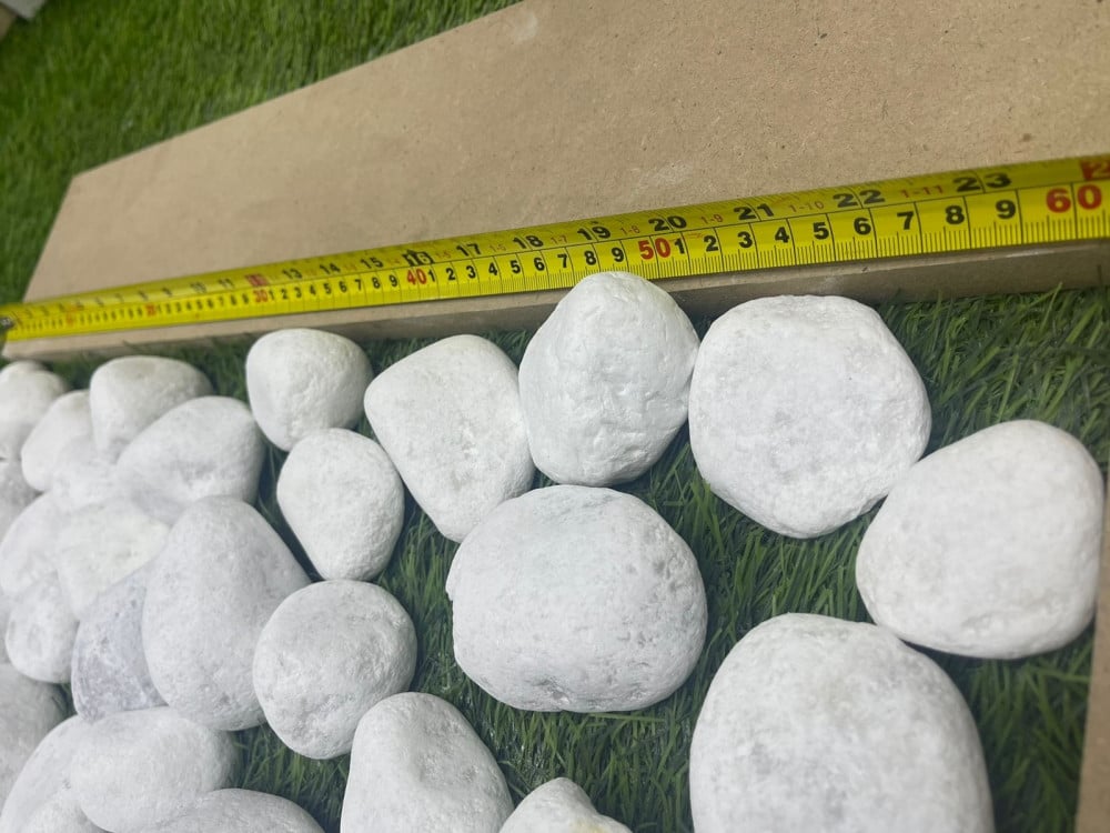 A large matte white decorative stone 5 kg package