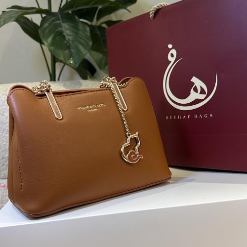 شنطه يد لون بني