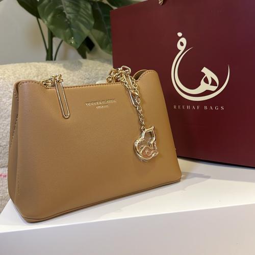 شنطه يد لون كاكي