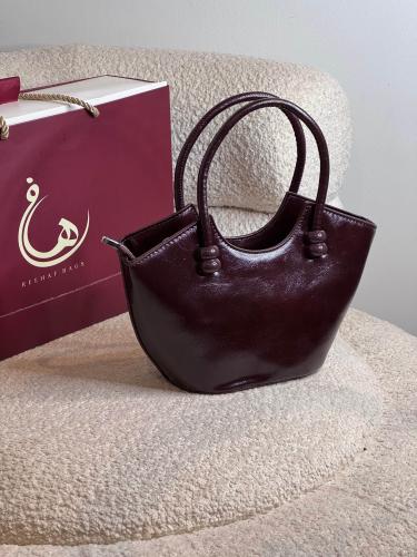 شنطة يد لون عنابي