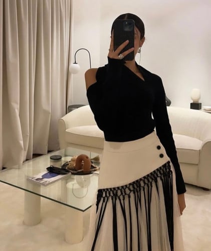 Black top with beige skirt