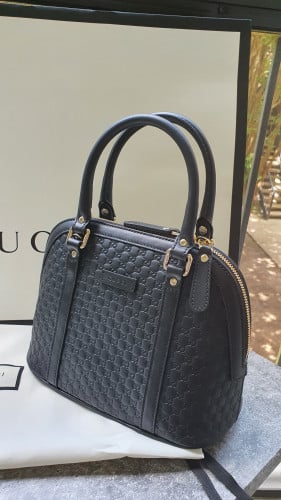 شنطة ماركة قوتشي