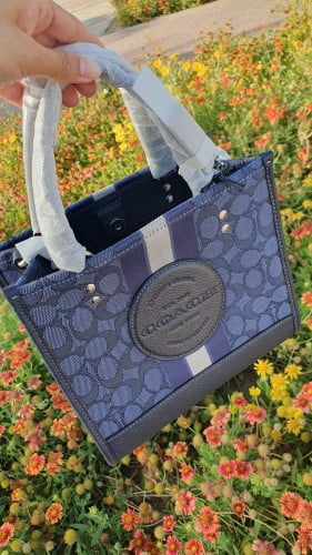 شنطة ماركة كوتش