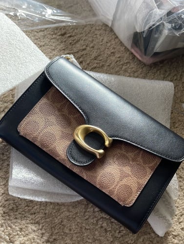 شنطة ماركة كوتش