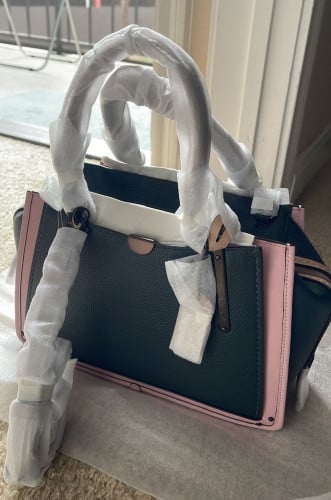 شنطة ماركة كوتش