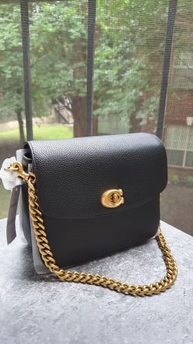 شنطة ماركة كوتش