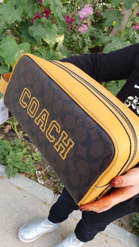 شنطة يد رجالية ماركة كوتش