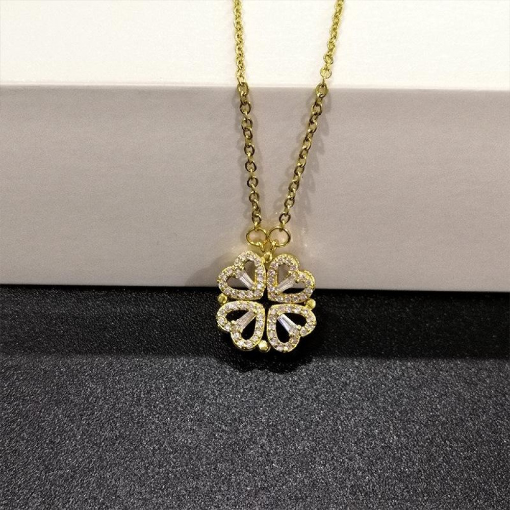 Necklace with gold steel chain and four-leaf clover with rhinestones