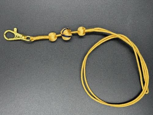 حامل بطاقة زري البشت ذهبي مع اسود