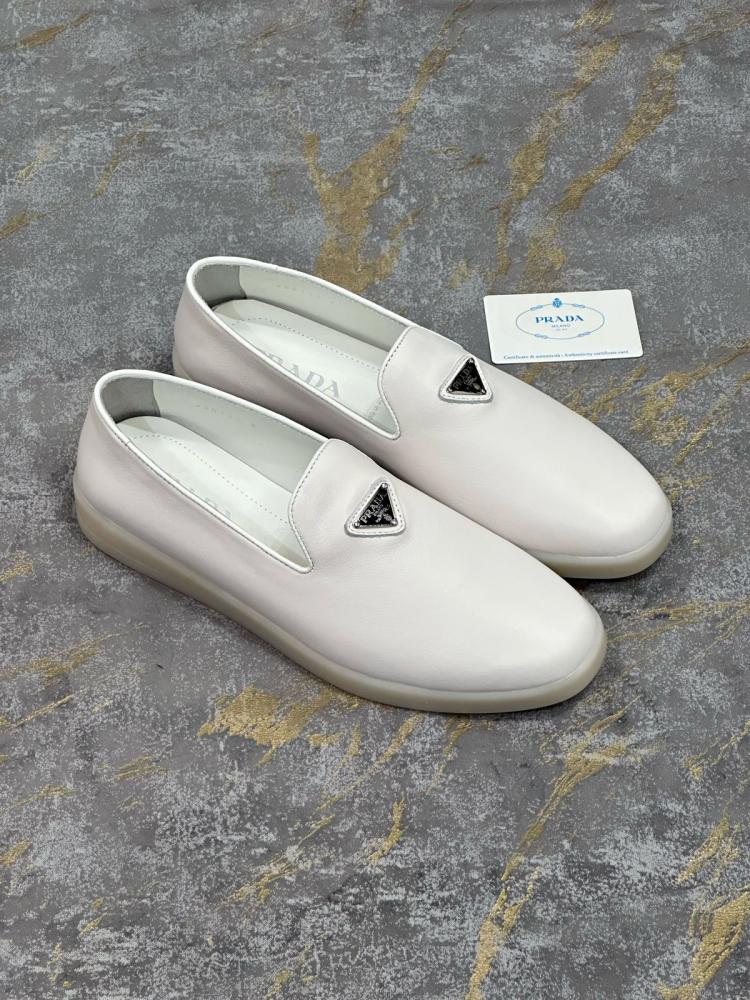 Prada men's flat shoes in white suede with black triangle logo