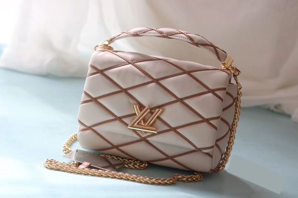 Louis Vuitton Twist Soft Luxury Bag in Beige and Gold