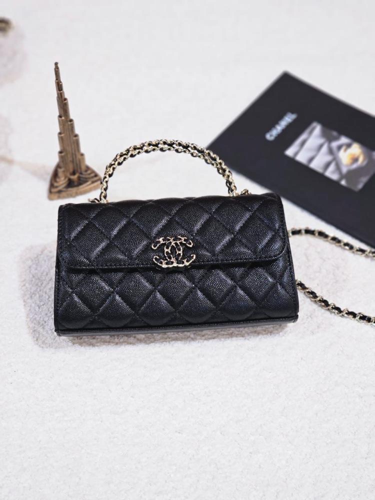 Black Chanel 19cm flap bag with handle and shoulder strap