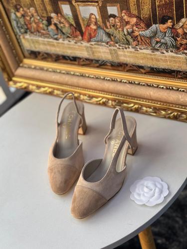 Chanel tweed mid-heel leather shoes in black with an elastic strap