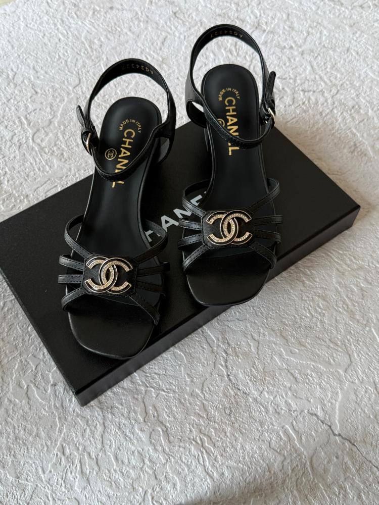 Chanel logo strap sandal with a medium heel in black