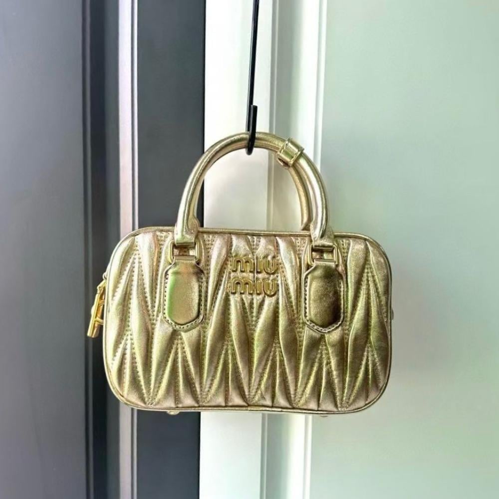 Mini Miu Miu bag with top handles in gold leather