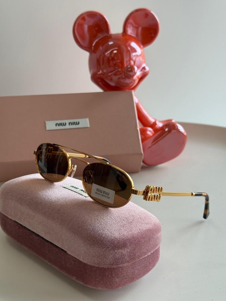 Miu Miu oval sunglasses in honey and gold