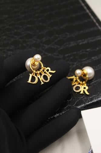 Dior Tribalis elegant pearl earrings with gold metal brand name