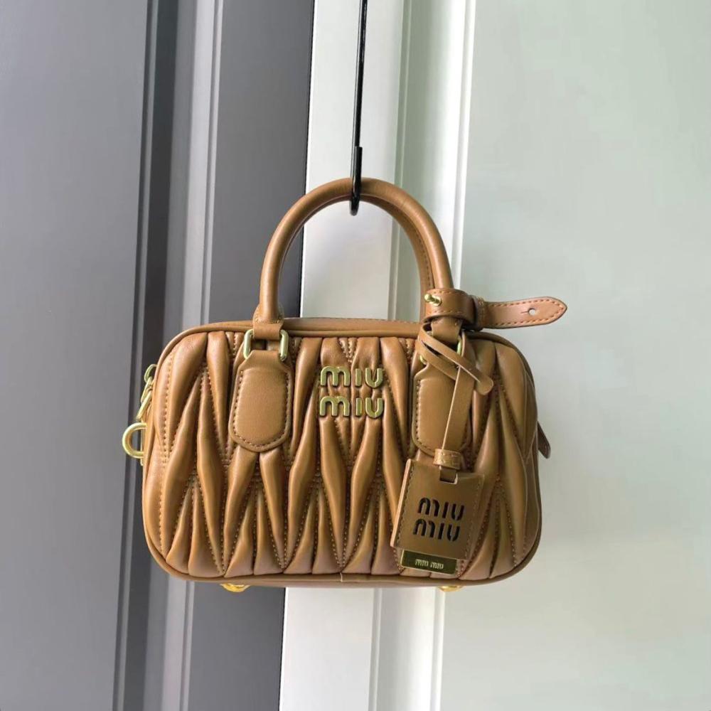 Miu Miu small bag with top handles in high-quality leather, honey color